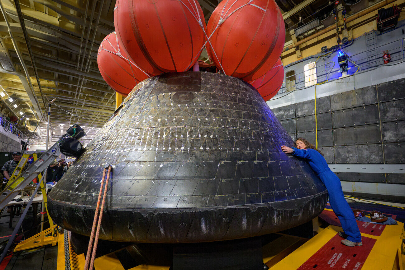 Artemis II Mission Specialist Christina Koch embraces the Orion spacecraft